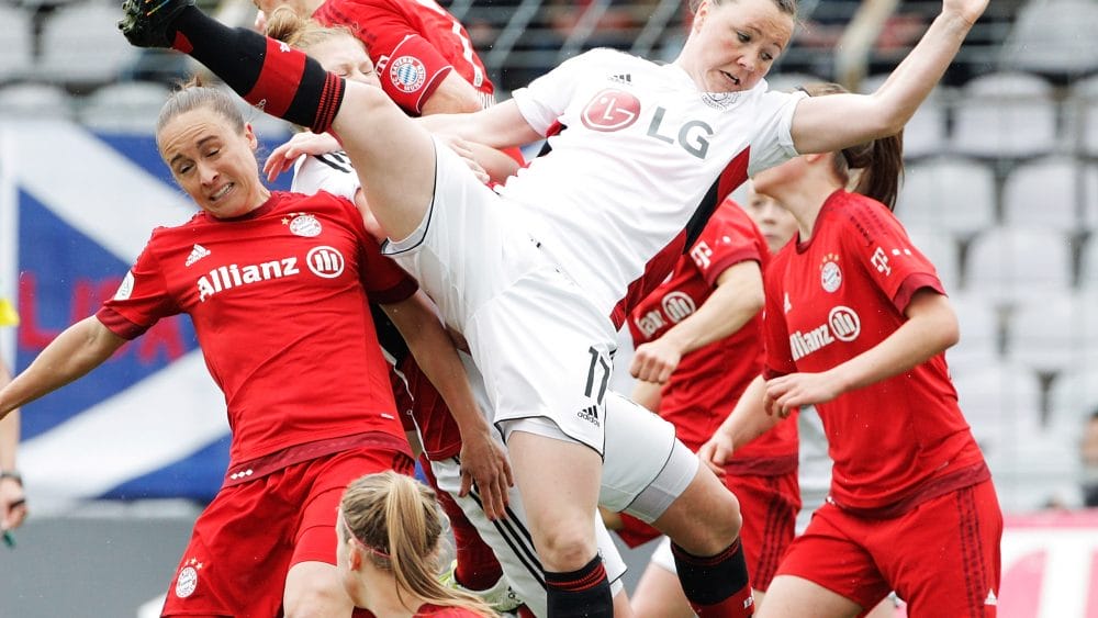 MUNICH, GERMANY - MAY 01: Marina Hegering of Bayer Leverkusen is thrown off balance as she competes for a corner kick during the Women's Bundesliga match at Gruenwalder Street Stadium on May 01, 2016 in Munich, Bavaria. (Photo by Adam Pretty/Bongarts/Getty Images)