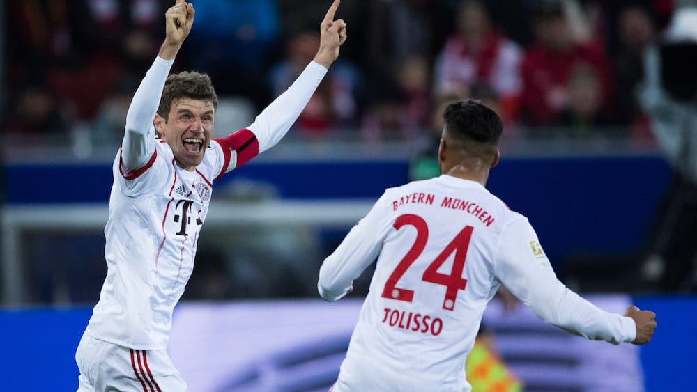 FREIBURG IM BREISGAU, GERMANY - MARCH 04: Thomas Mueller of Muenchen celebrates his team's first goal with team mate Corentin Tolisso during the Bundesliga match between Sport-Club Freiburg and FC Bayern Muenchen at Schwarzwald-Stadion on March 4, 2018 in Freiburg im Breisgau, Germany. (Photo by Simon Hofmann/Bongarts/Getty Images)