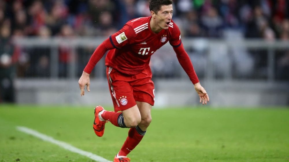 MUNICH, GERMANY - MARCH 09: Robert Lewandowski of Bayern Munich scores his team's sixth goal during the Bundesliga match between FC Bayern Muenchen and VfL Wolfsburg at Allianz Arena on March 09, 2019 in Munich, Germany. (Photo by Alex Grimm/Bongarts/Getty Images)