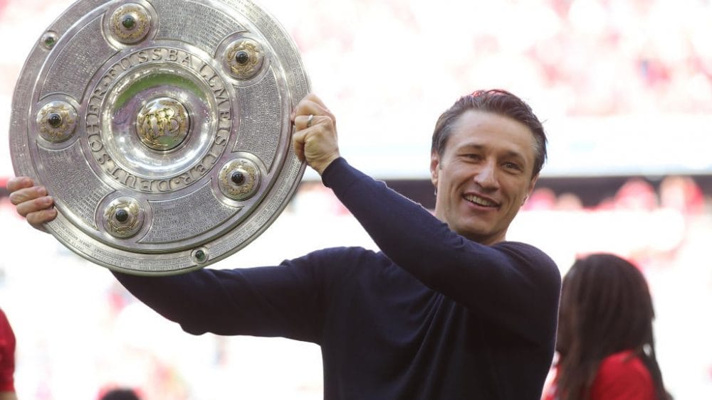 MUNICH, GERMANY - MAY 18: Niko Kovac, Manager of Bayern Munich lifts the trophy following the Bundesliga match between FC Bayern Muenchen and Eintracht Frankfurt at Allianz Arena on May 18, 2019 in Munich, Germany. (Photo by Alexander Hassenstein/Bongarts/Getty Images)