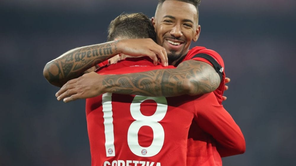 MUNICH, GERMANY - JANUARY 25: Leon Goretzka of FC Bayern Muenchen celebrates after scoring his team`s third goal with Jerome Boateng of FC Bayern Muenchen during the Bundesliga match between FC Bayern Muenchen and FC Schalke 04 at Allianz Arena on January 25, 2020 in Munich, Germany. (Photo by Christian Kaspar-Bartke/Bongarts/Getty Images)