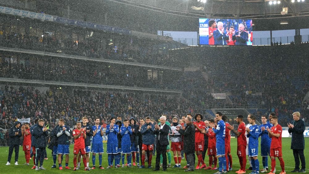 SINSHEIM, GERMANY - FEBRUARY 29: Karl-Heinz Rummenigge and Dietmar Hopp come together with players to applaud the home fans after demonstrations after the Bundesliga match between TSG 1899 Hoffenheim and FC Bayern Muenchen at PreZero-Arena on February 29, 2020 in Sinsheim, Germany. (Photo by Matthias Hangst/Bongarts/Getty Images)